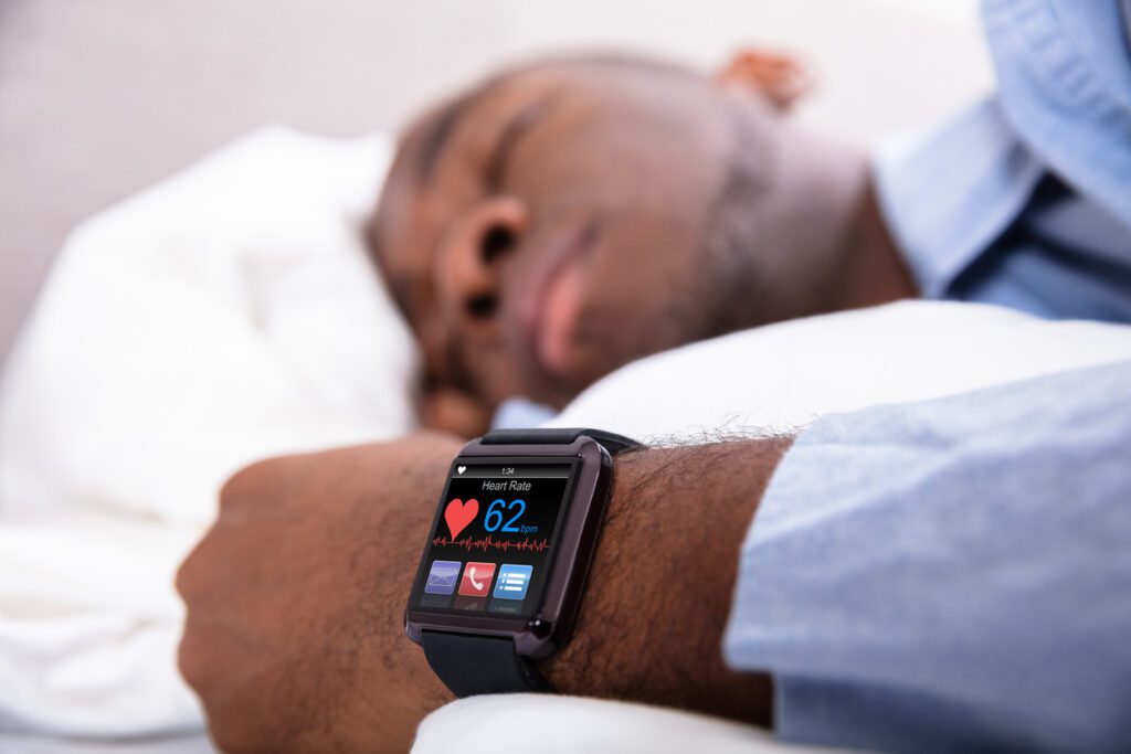Man Sleeping With Smart Watch In His Hand