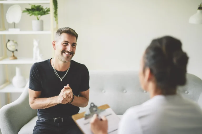 man talking to therapist in office