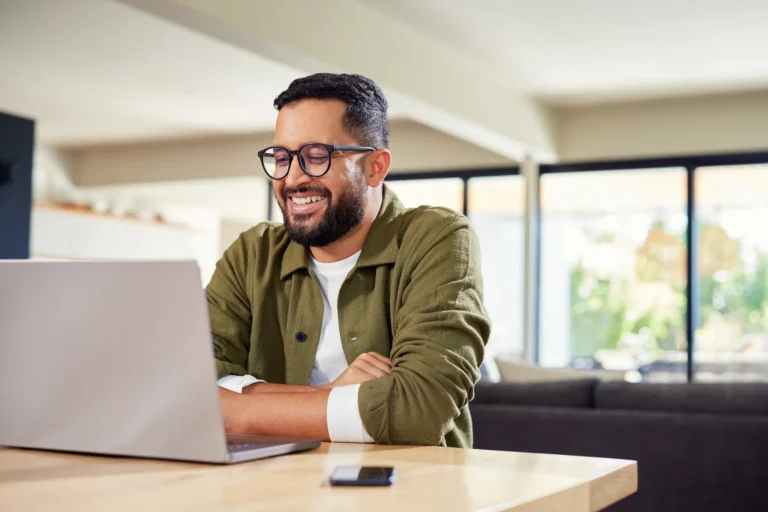 man using laptop at home