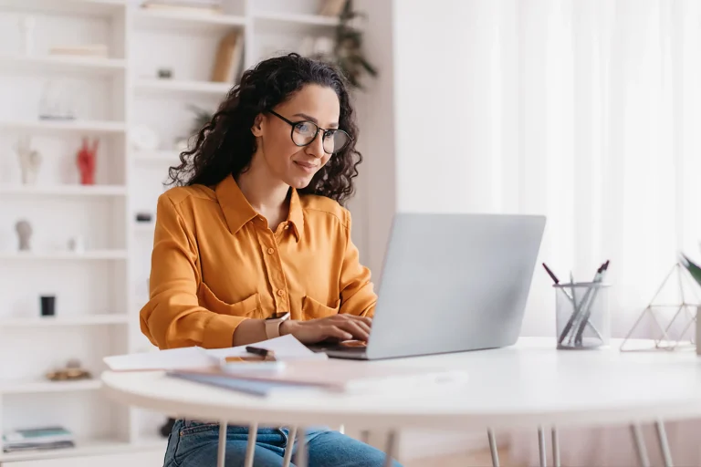 woman using laptop for teladoc